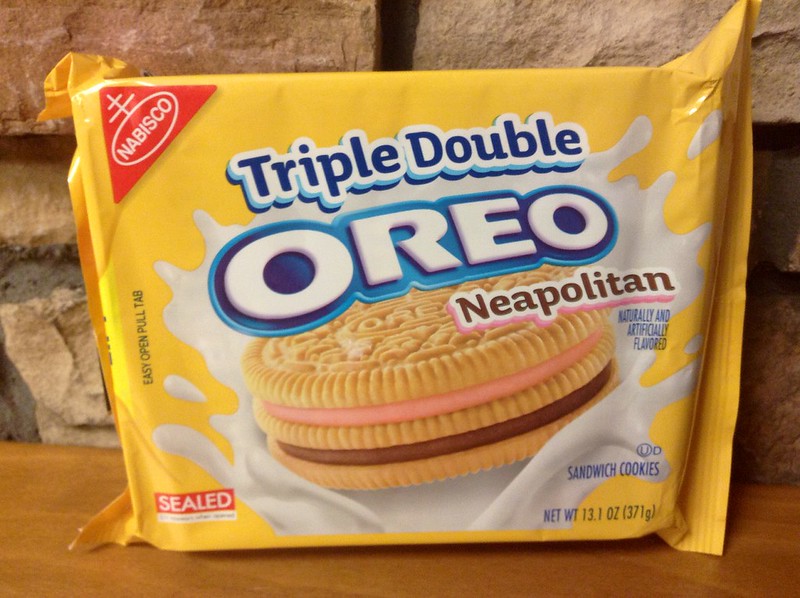 Triple Double Neapolitan Oreo Cookies placed on a wooden surface