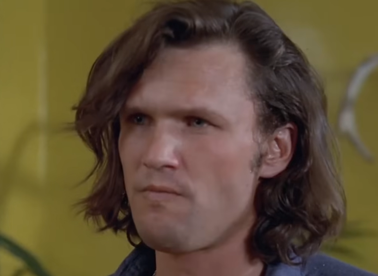 Screenshot of Kris Kristofferson looking at side from - Cisco Pike (1971)