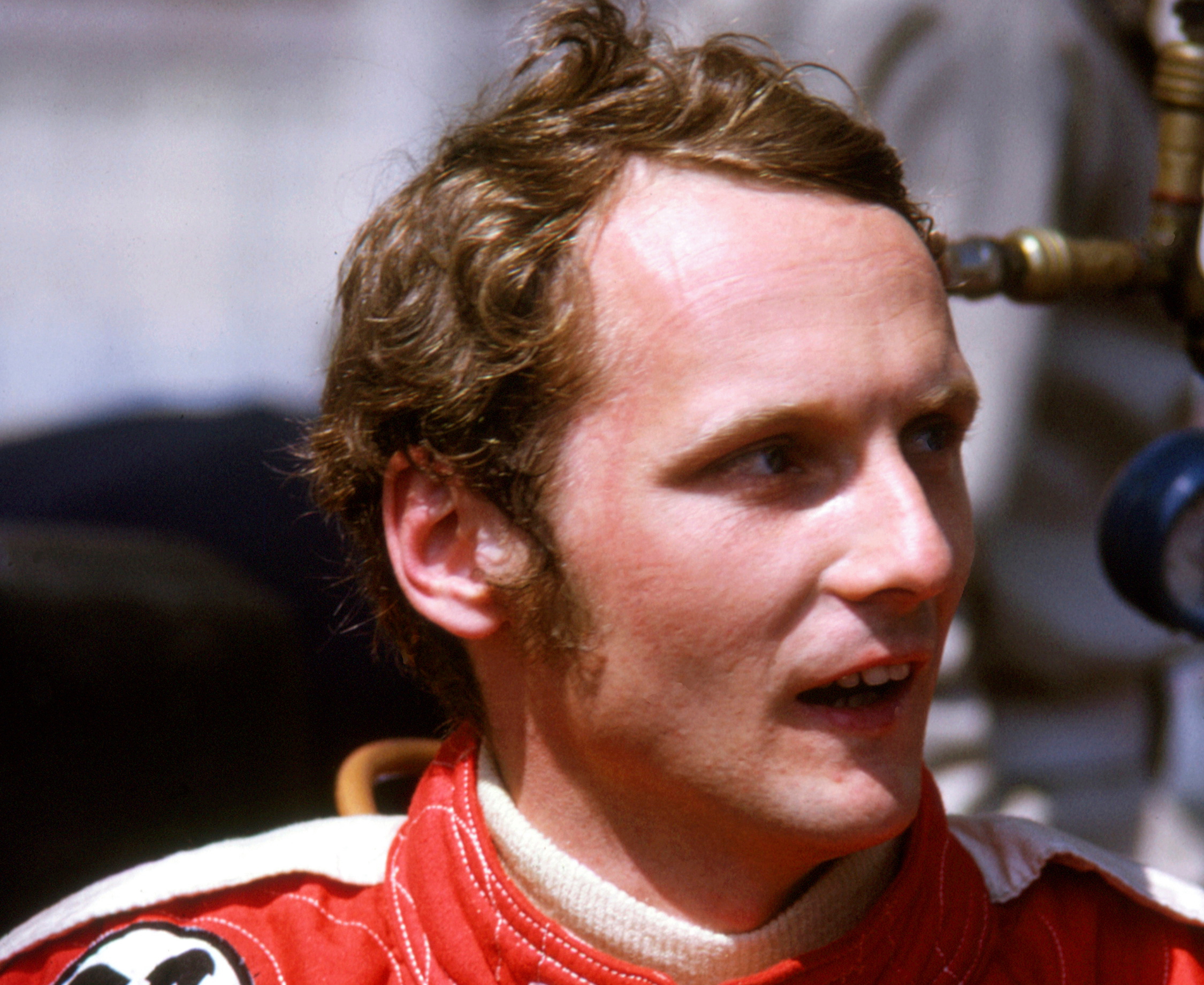 Niki Lauda, Austrian racing driver in red racing outfit