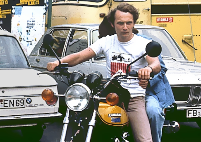 Niki Lauda in white t-shirt on a motorcycle