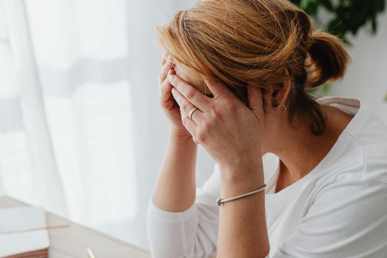 A woman sitting on a desk