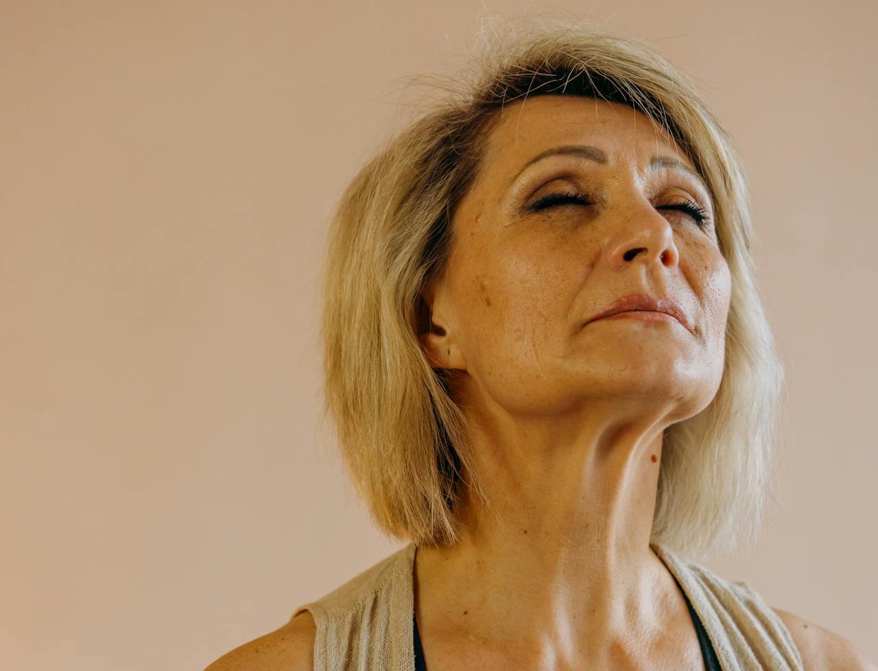 Elderly woman in black tank top