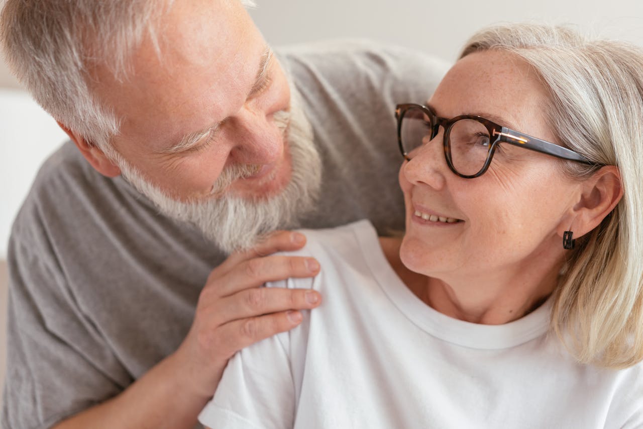 An elderly couple smiling