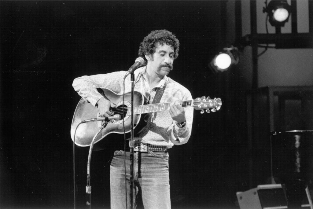 Jim Croce Photo performing on stage with his guitar