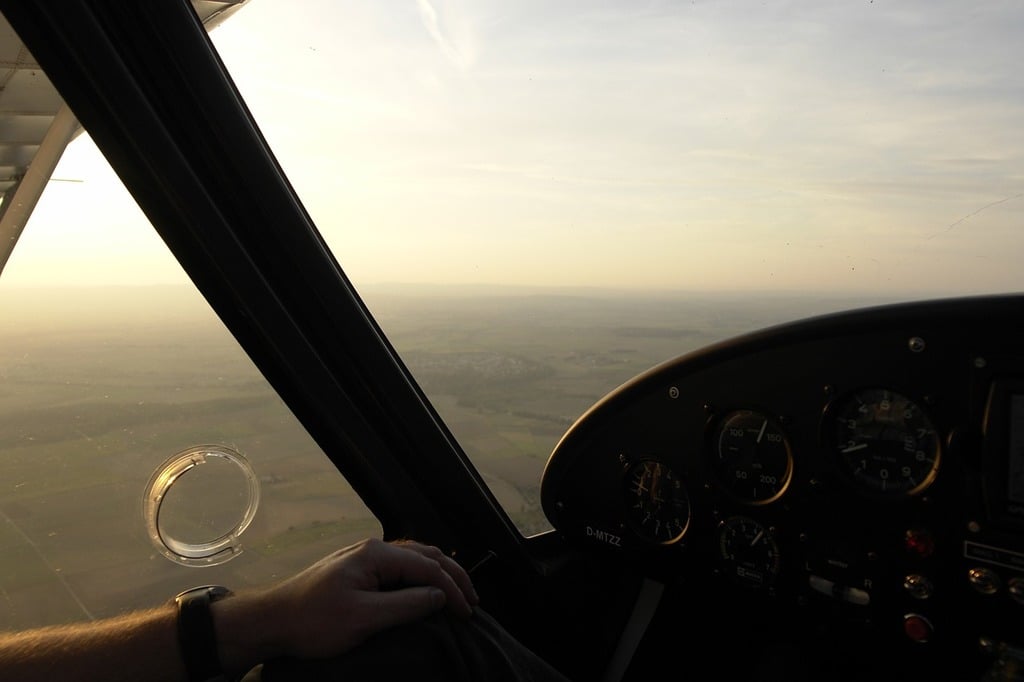 A person sitting in a cockpit