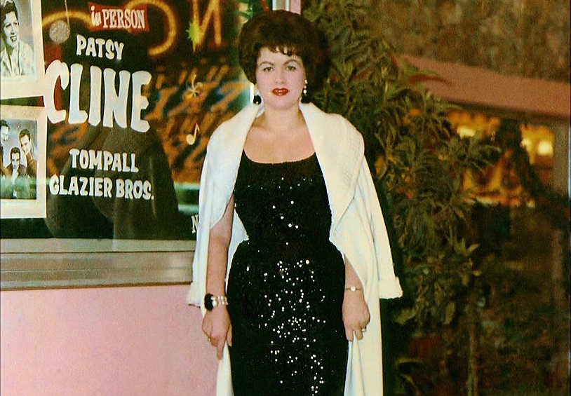 Patsy Cline wearing a black dress