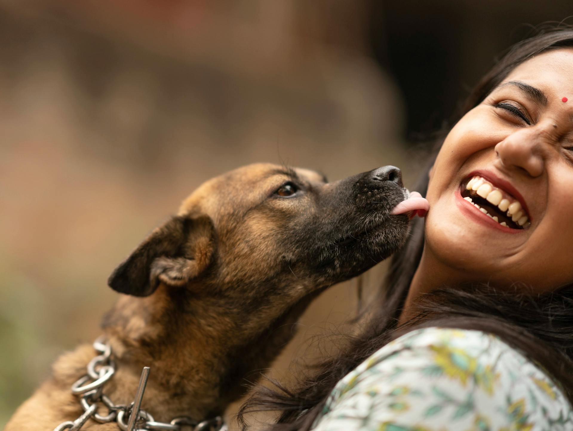Dog licking a woman