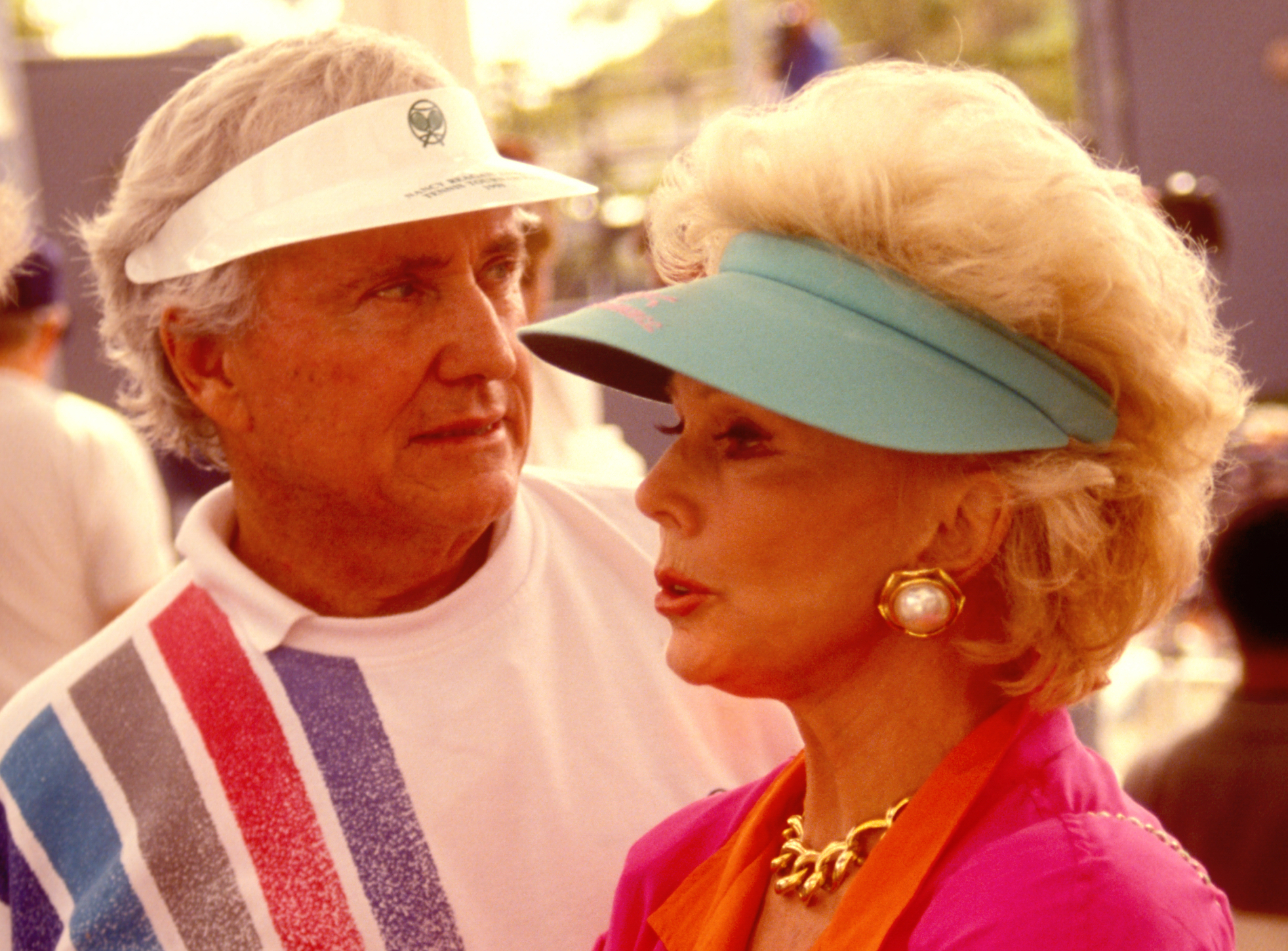 Merv Griffin and the famous actress Eva Gabor wearing a hat