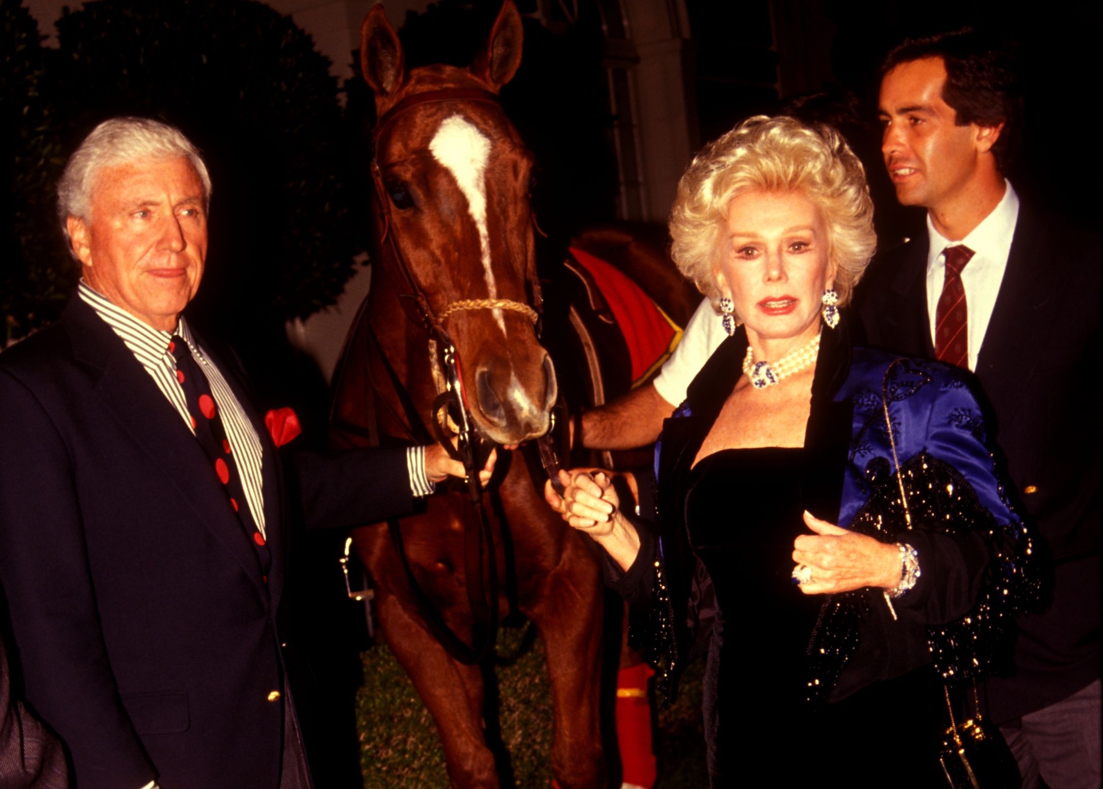 Merv Griffin and Eva Gabor pose with a pony