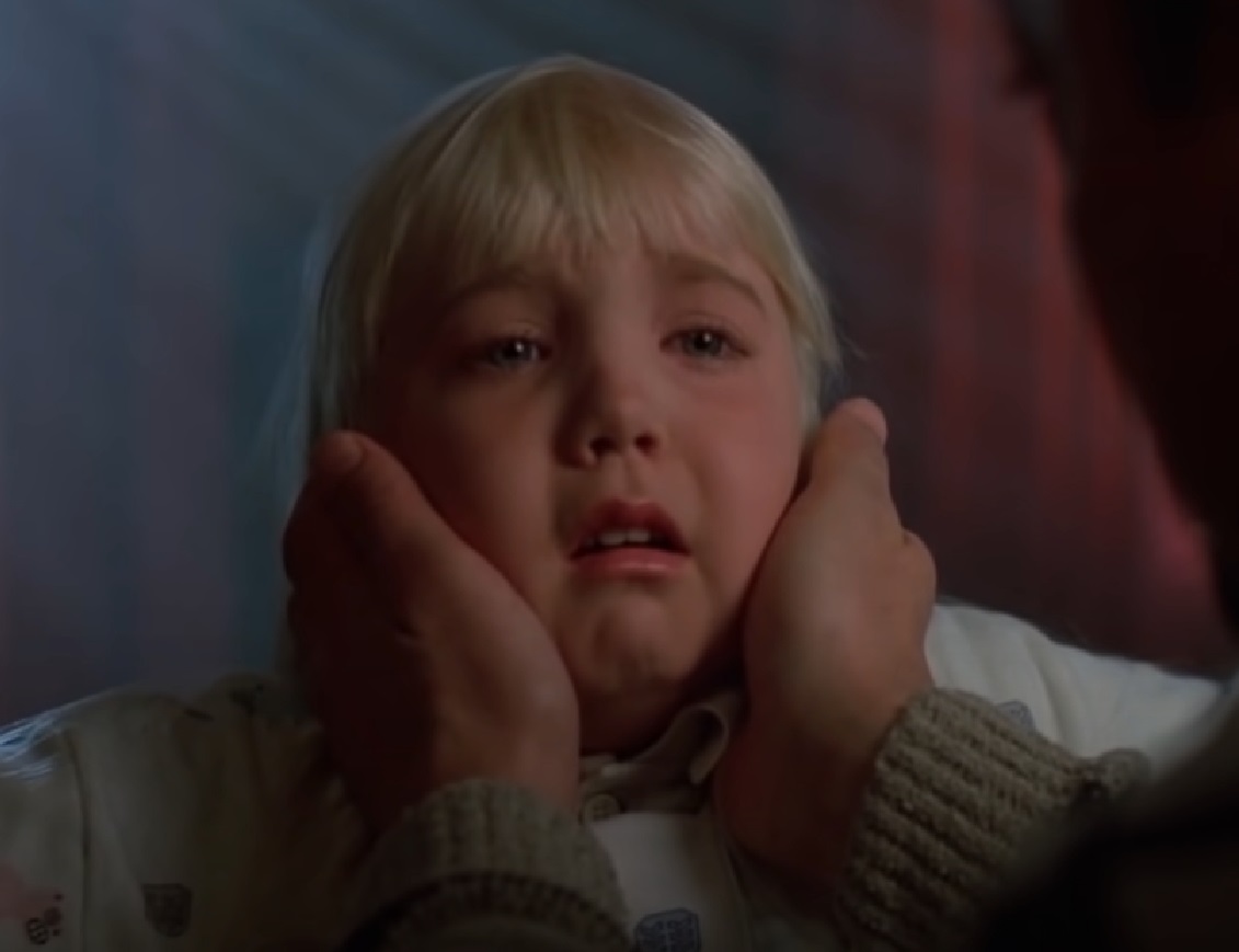 Screenshot of Heather O'Rourke looking scared from - Poltergeist III (1998)
