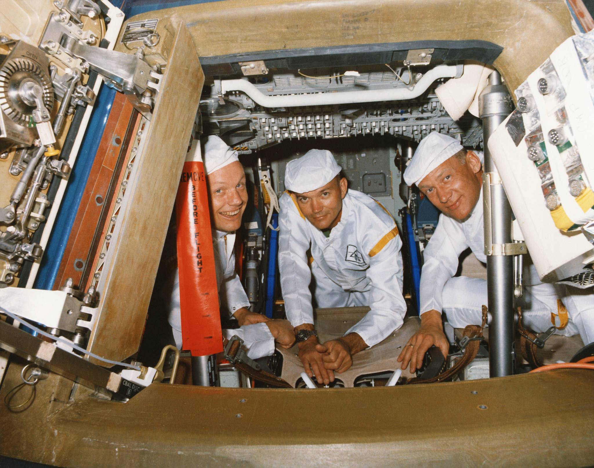 Apollo 11 crew poses for a photograph during a walk-through egress test