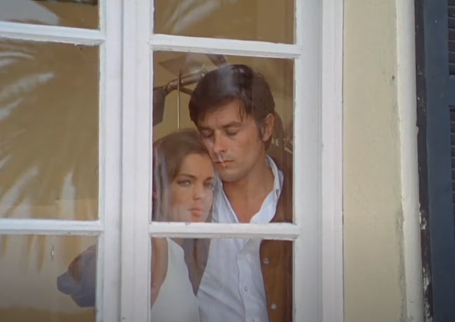 Screenshot of the movie The Swimming Pool (1969) showing Alain Delon and Romy Schneider