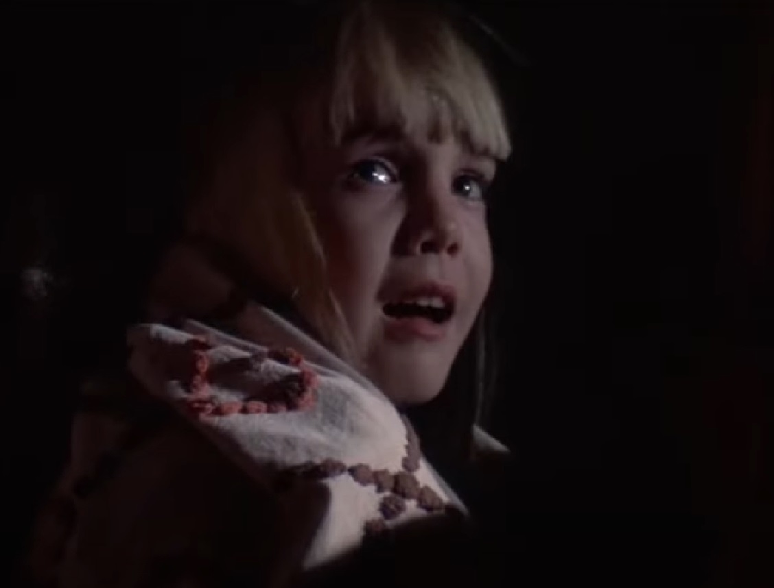Screenshot of Heather O'Rourke looking scared from - Poltergeist II: The Other Side (1986)
