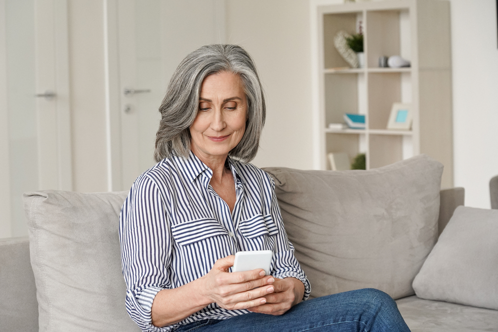 Mature woman using smartphone