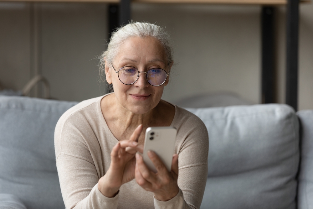 mature woman using smartphone