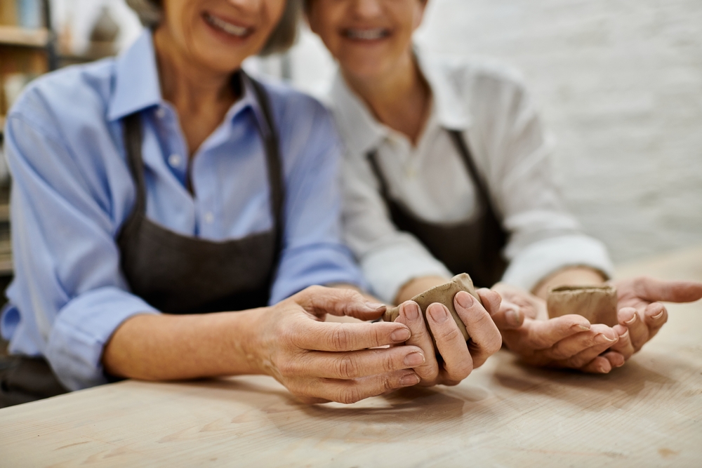 LGBTQ senior women in a pottery class