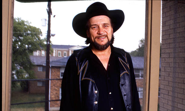 Waylon Jennings posing for a photo
