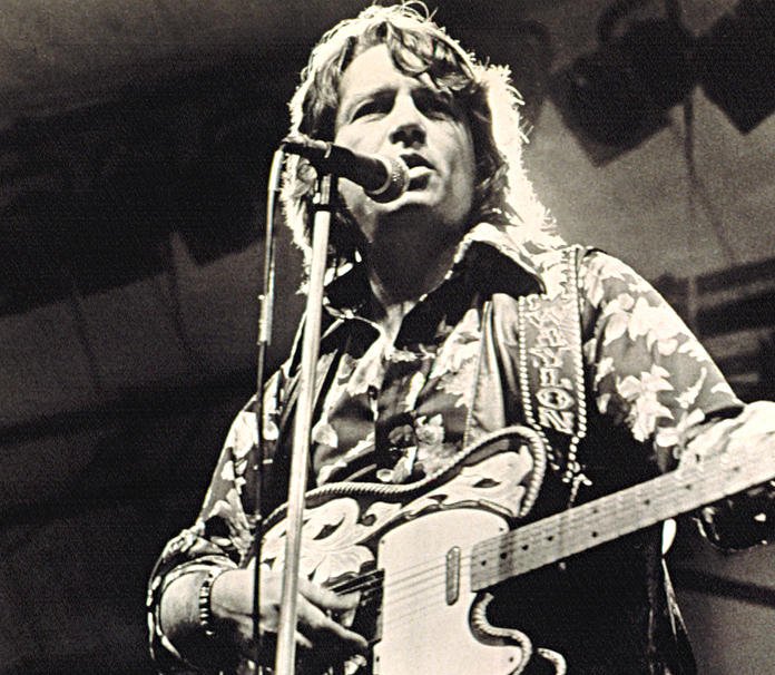 Waylon Jennings In 1973 on stage