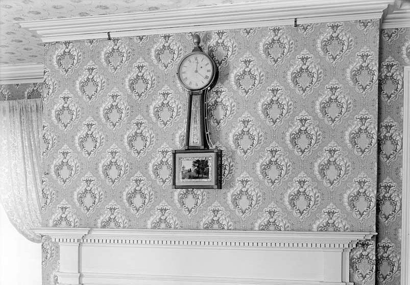 Banjo clock on a wall