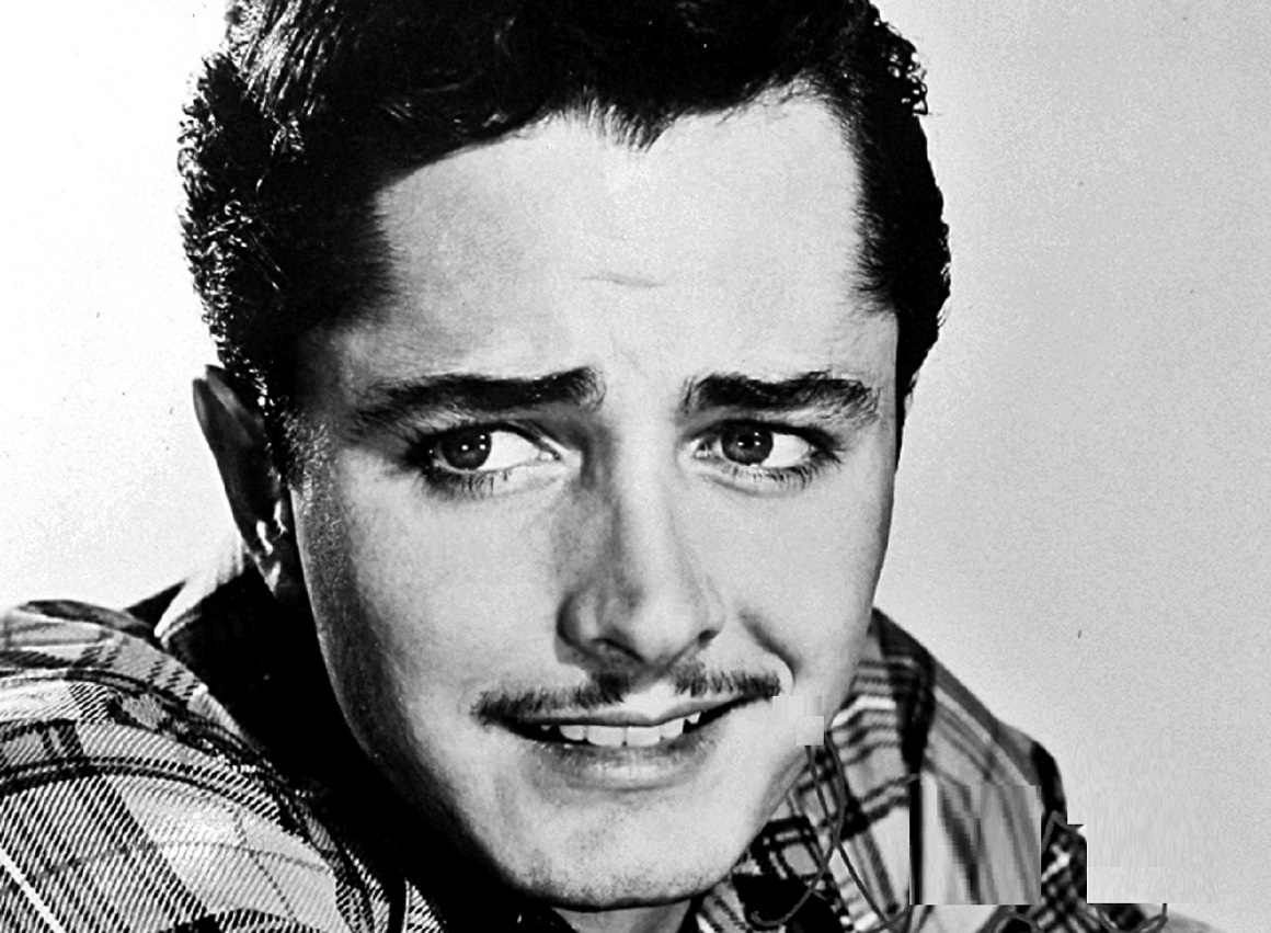 Publicity photo of John Derek - 1949