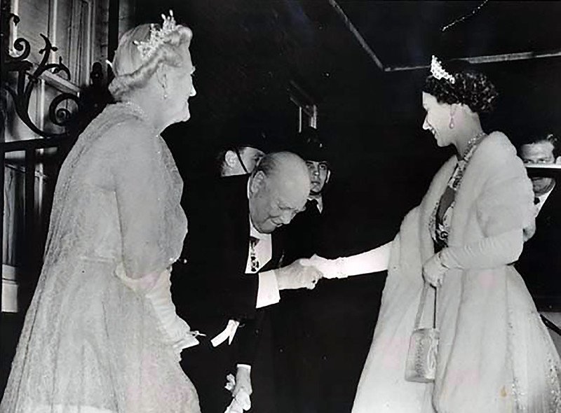Queen Elizabeth II is greeted by Winston and Clementine Churchill
