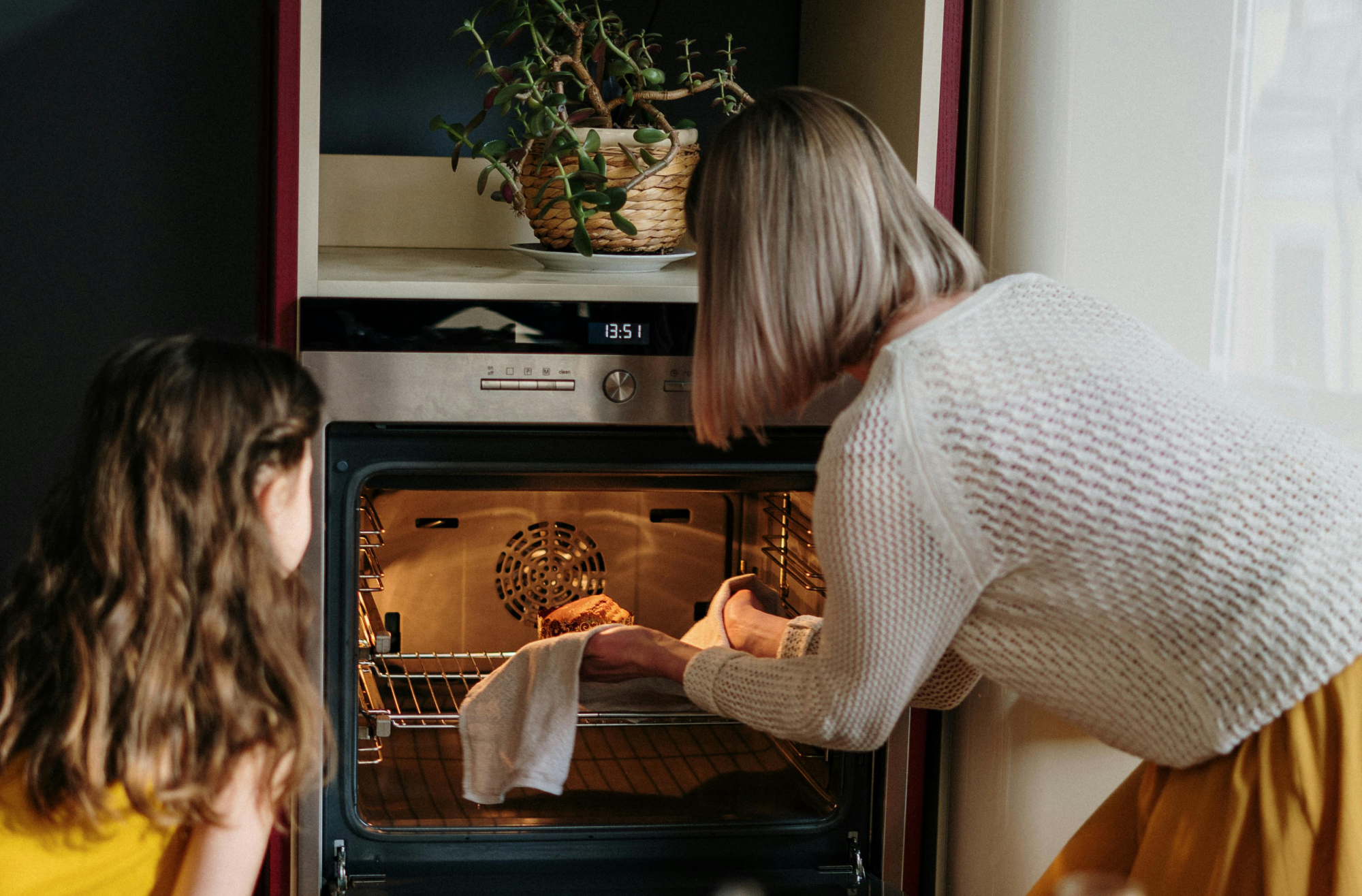 Woman in White Sweater Baking Cake