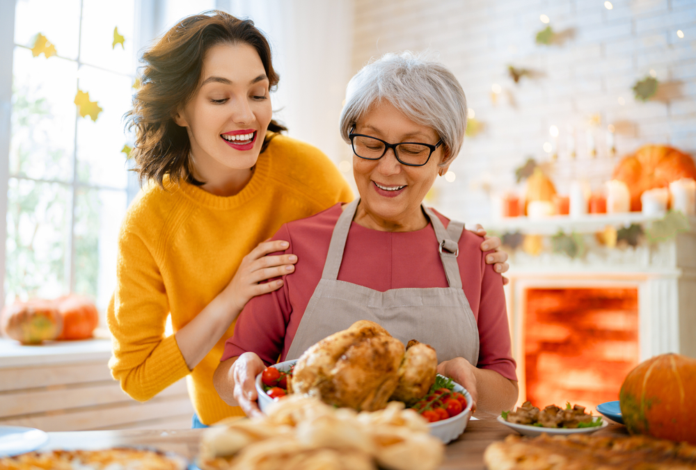 Family preparing traditional Thanksgiving dinner