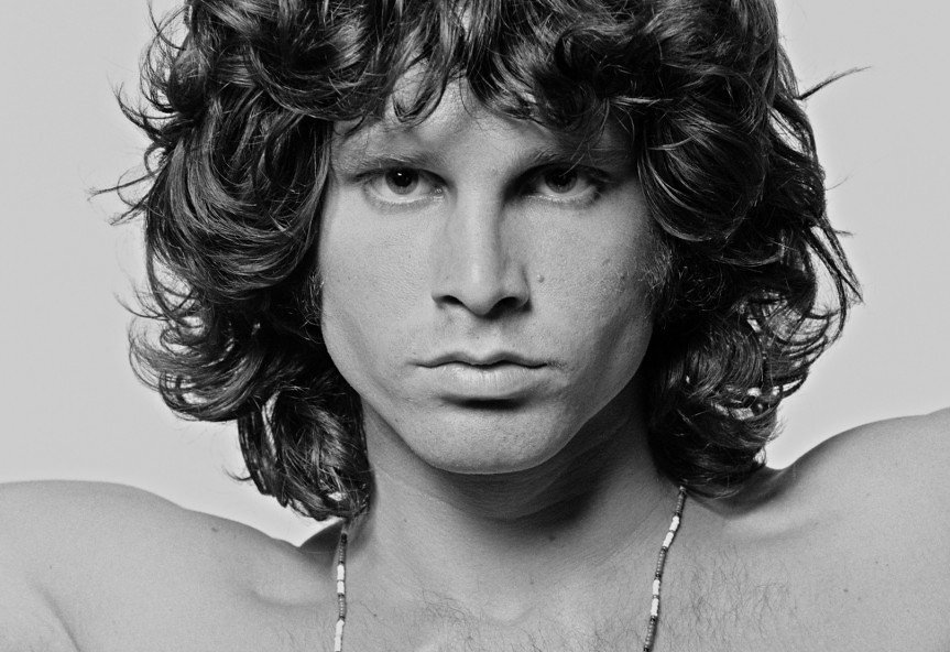 Photo of Jim Morrison with a necklace on his heck