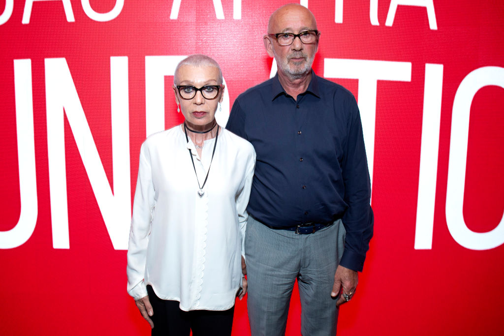 Irina Korina and Viktor Yelchin at an event in semi formal clothes and glasses