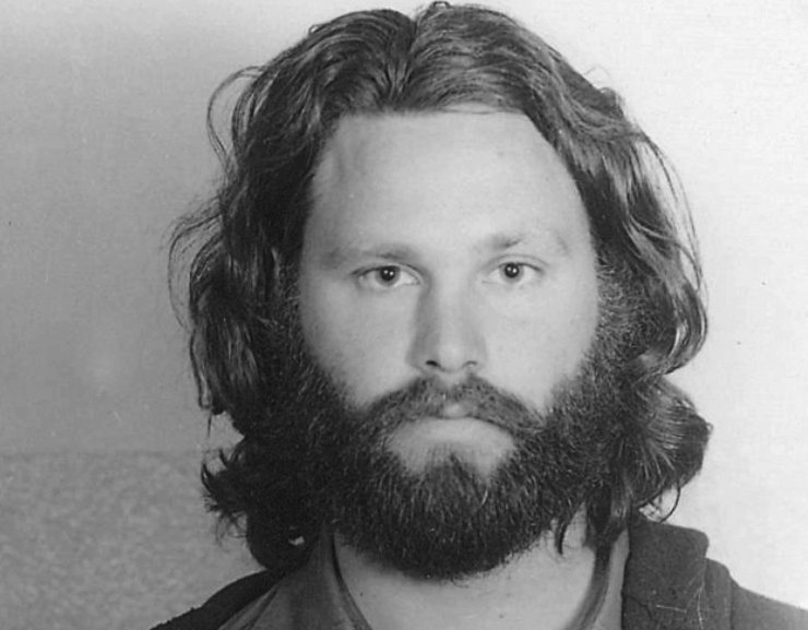 Mug Shot of Jim Morrison in a black shirt