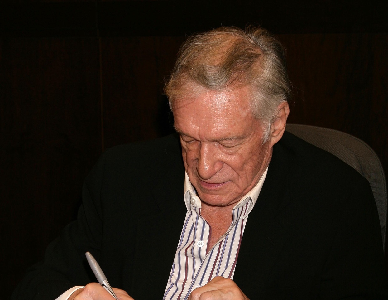 Hugh Hefner at an in store appearance signing copies of his books