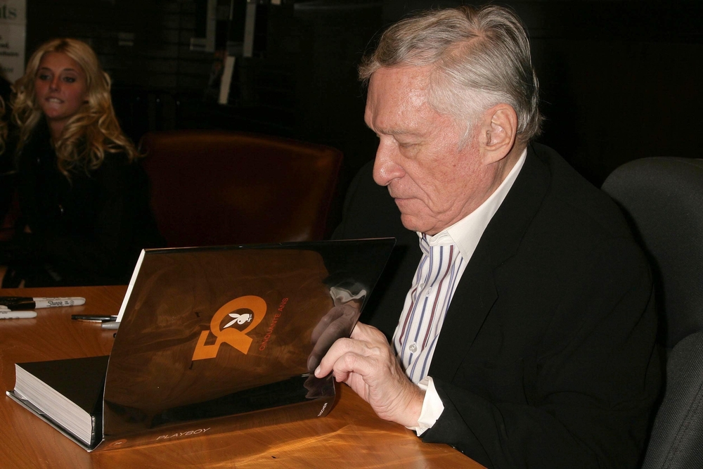 Hugh Hefner at an in store appearance signing copies of his books