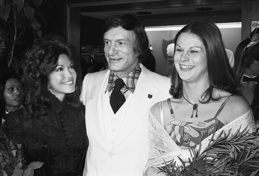Hugh Hefner, 49 years old, American Playboy magazine publisher with several Playboy Bunnies - 1975