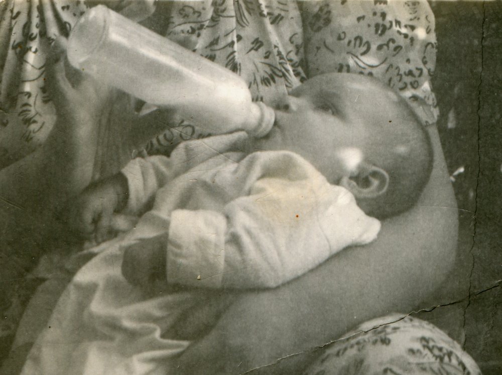 Vintage photo of mother feeding her daughter
