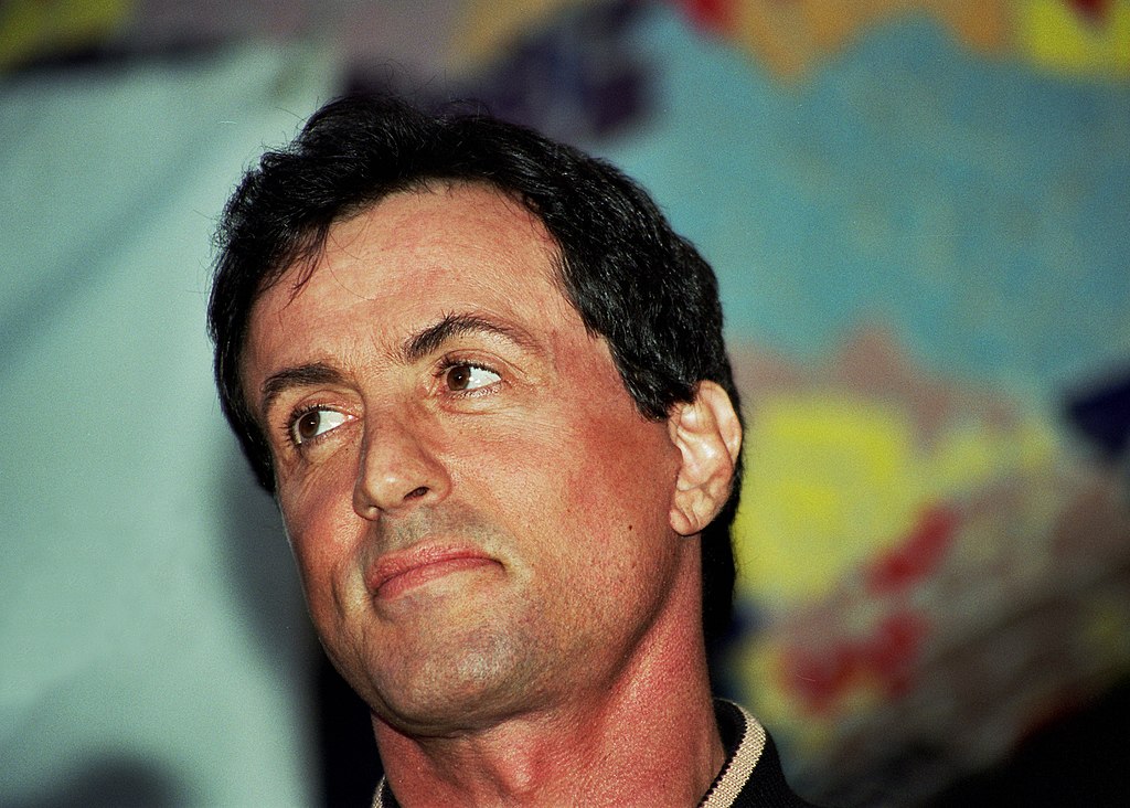 Actor Sylvester Stallone looking away from the camera
