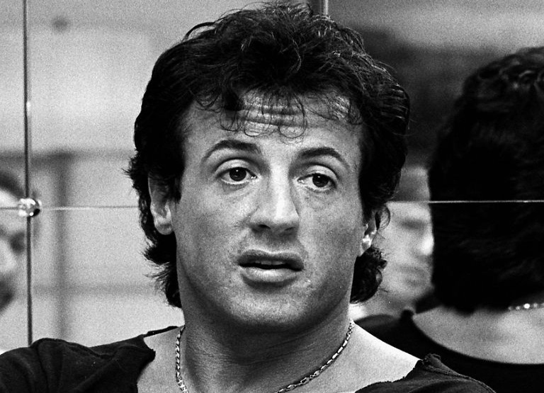 Actor Sylvester Stallone wearing a white shirt