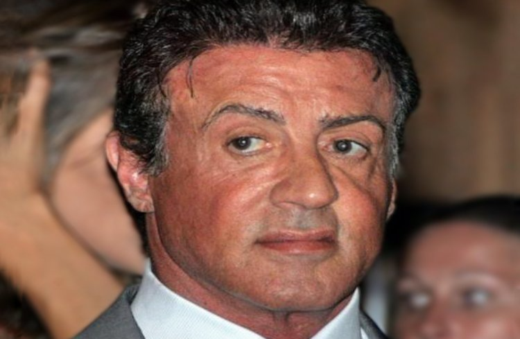 Actor Sylvester Stallone in a white shirt