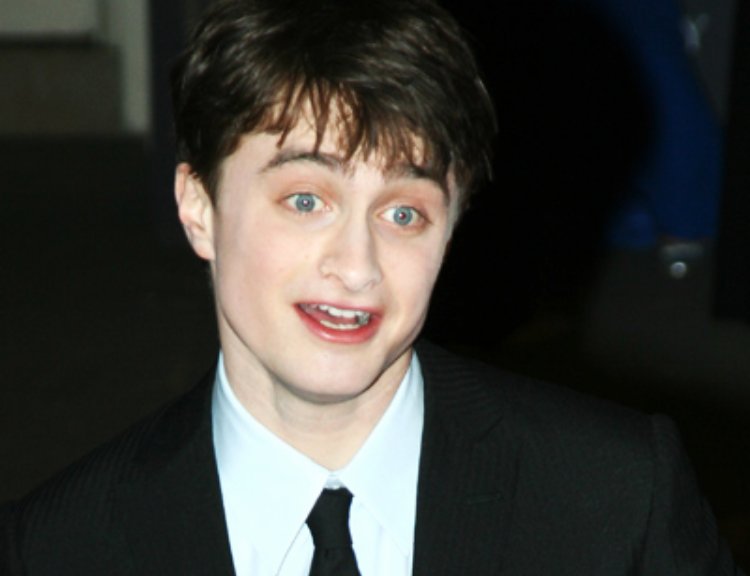 Daniel Radcliffe wearing a black suit