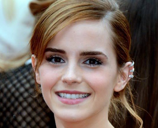 Emma Watson wearing silver earrings
