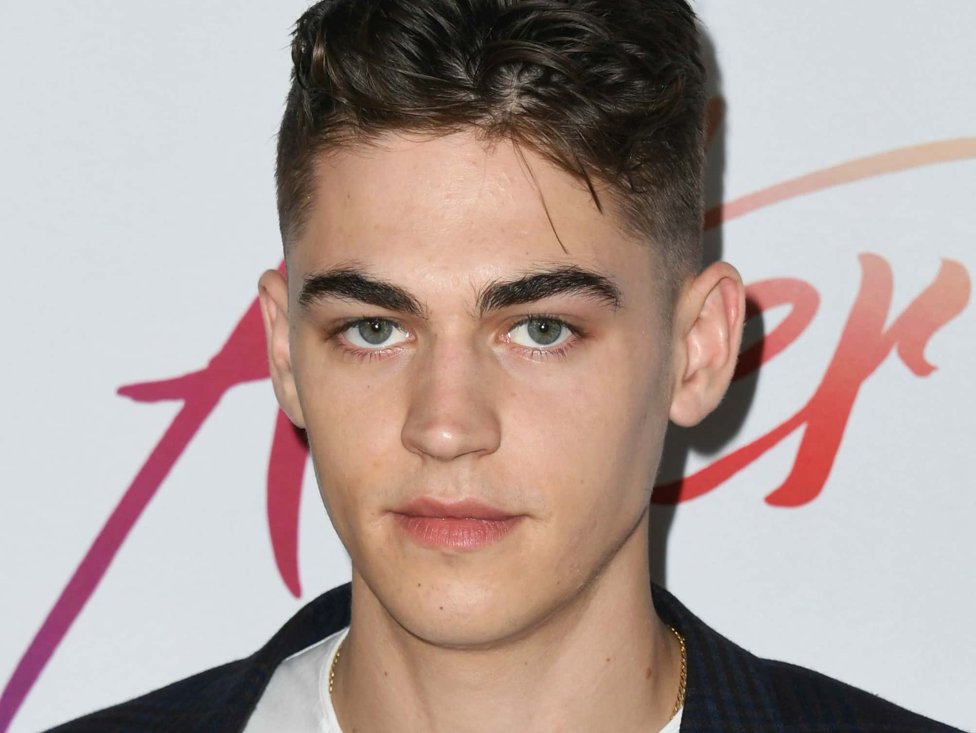 Hero Fiennes Tiffin wearing black shirt