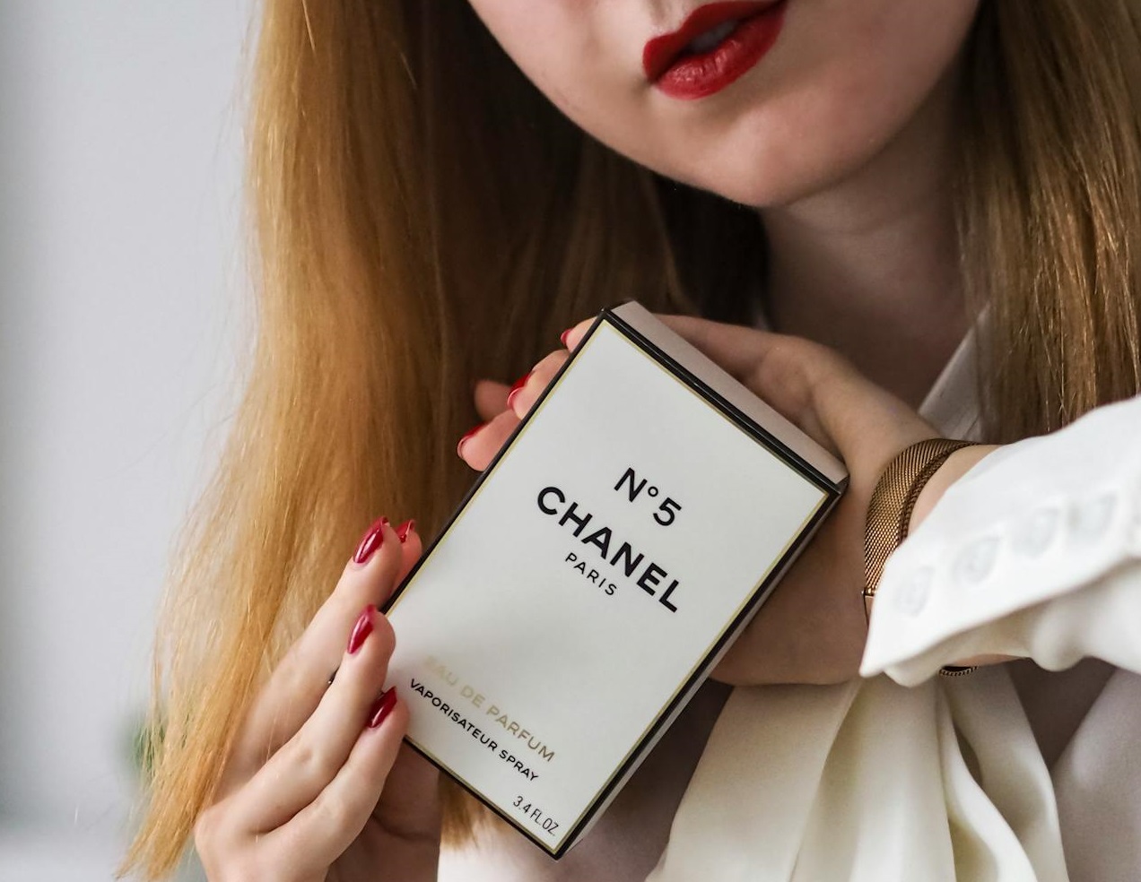 Woman Holding Chanel No.5 Perfume Box