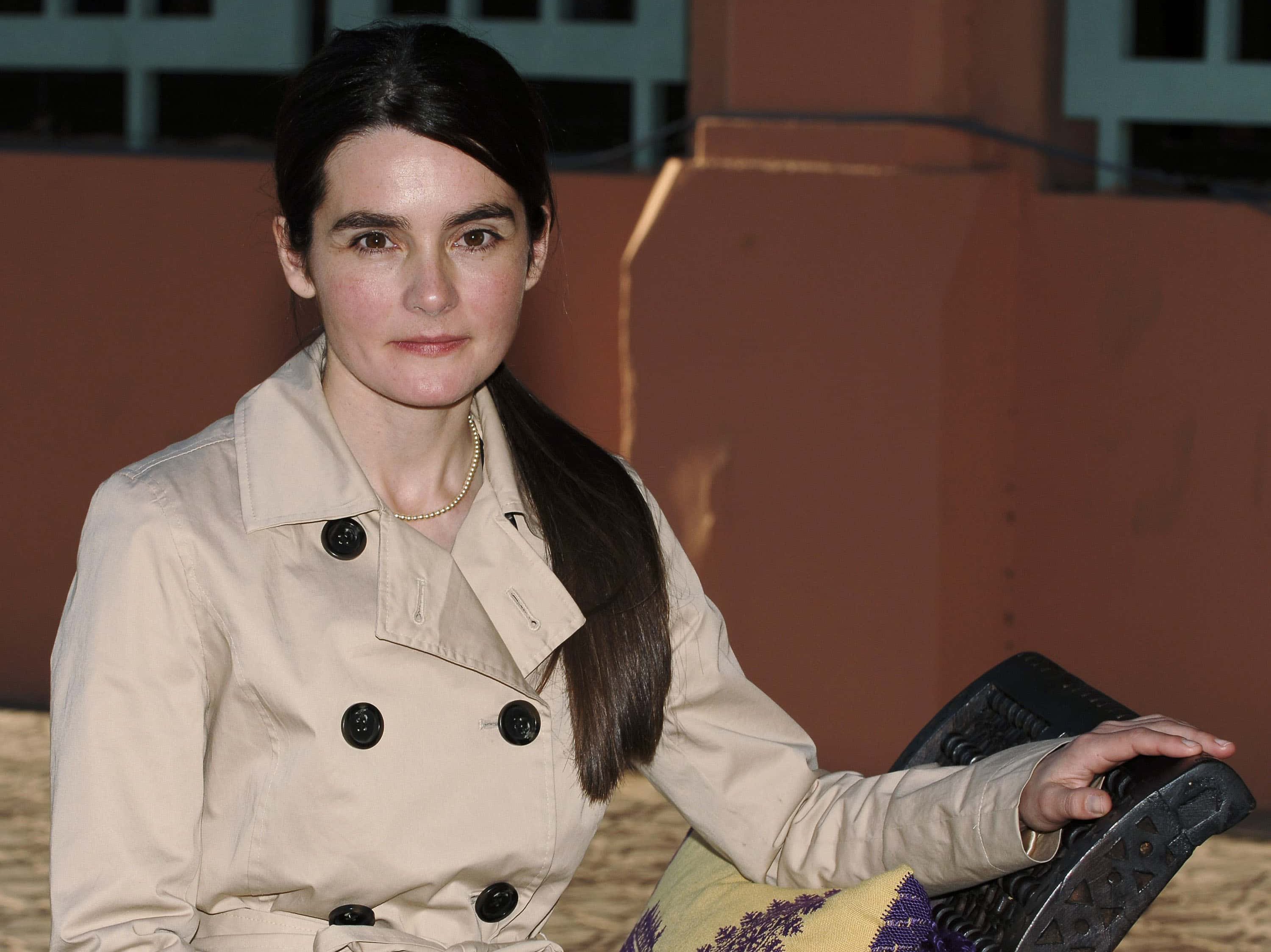 Actress Shirley Henderson wearing a trench coat