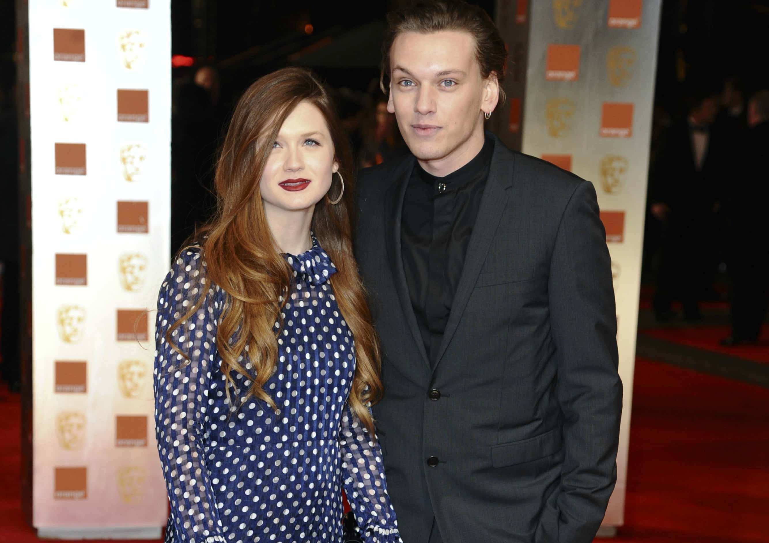 Bonnie Wright and Jamie Campbell on a red carpet