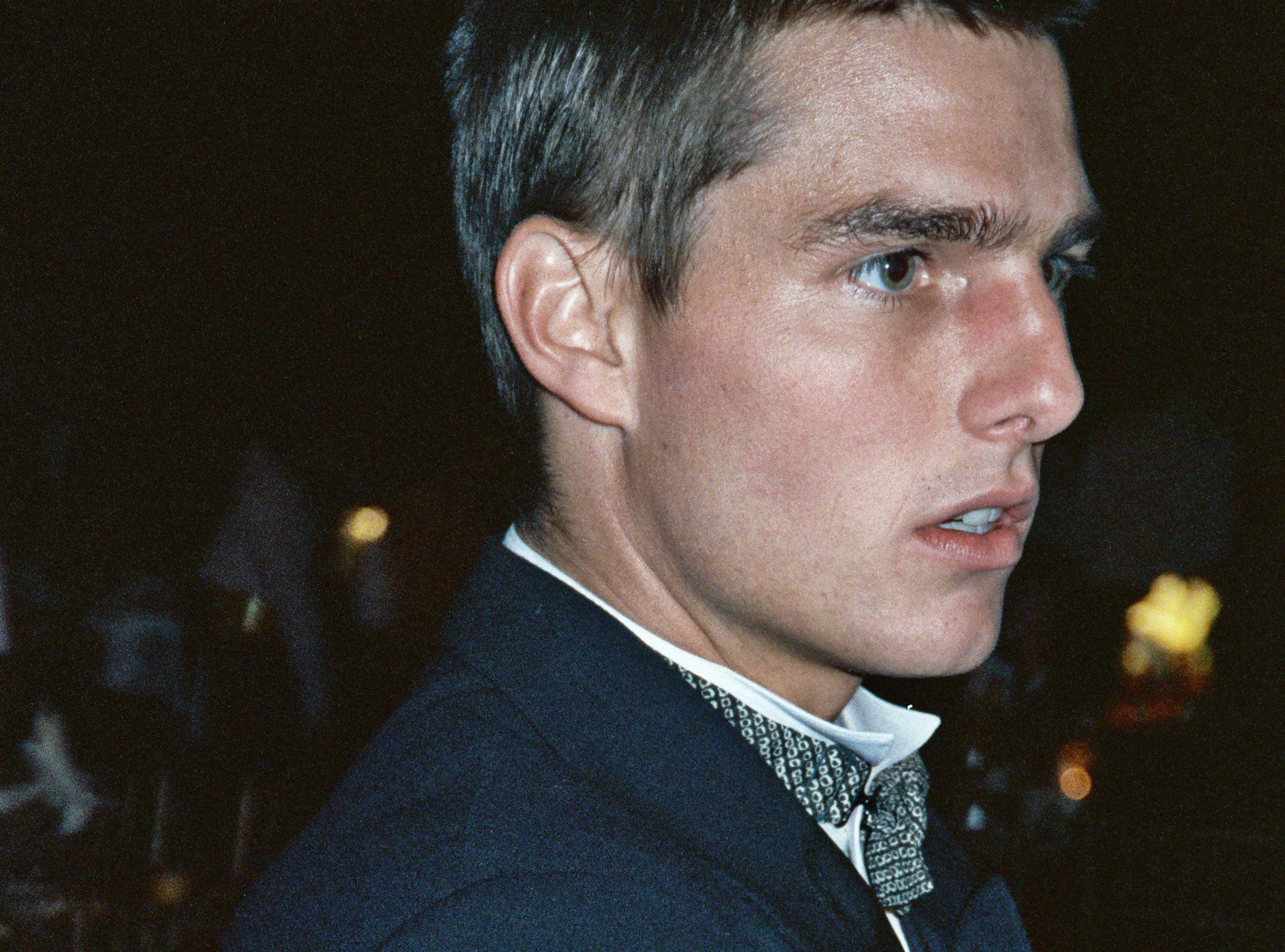 Tom Cruise wearing a black jacket