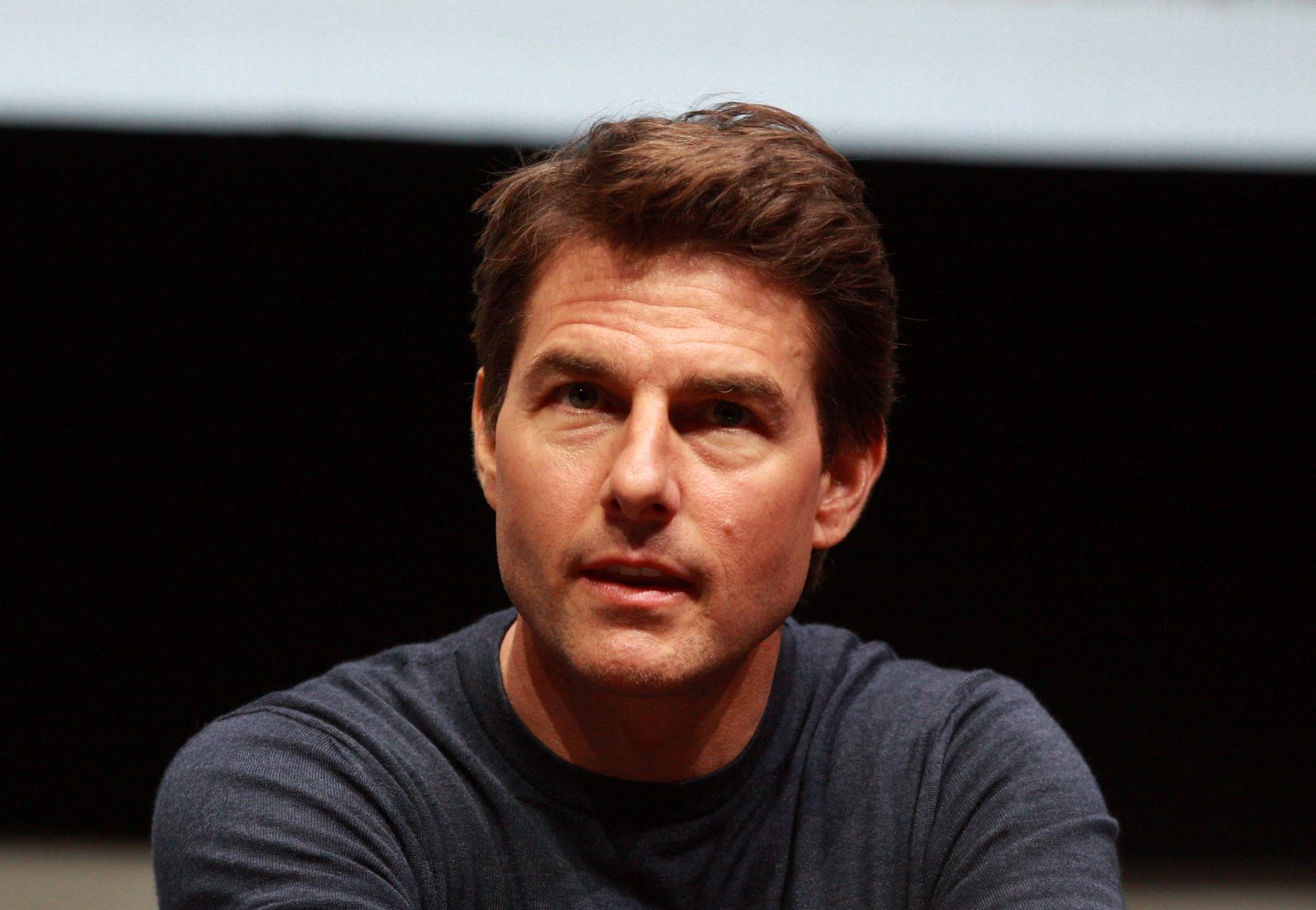 Tom Cruise wearing a gray shirt