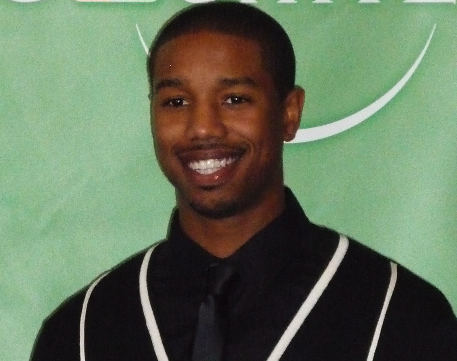 Michael B. Jordan in a black shirt