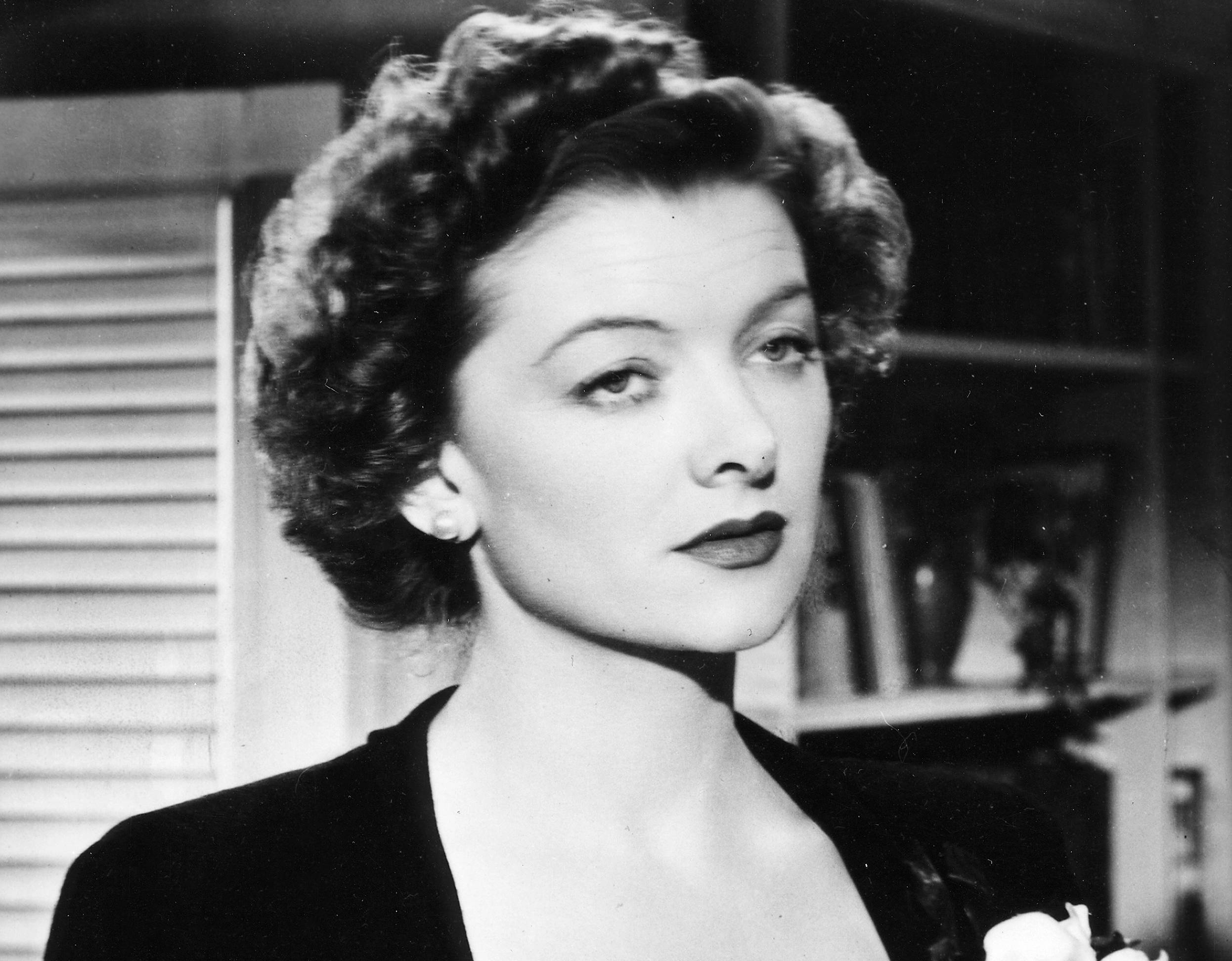 Myrna Loy in black dress