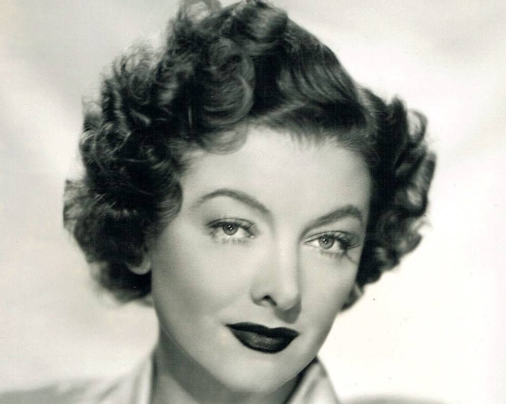 Myrna Loy in shiny shirt