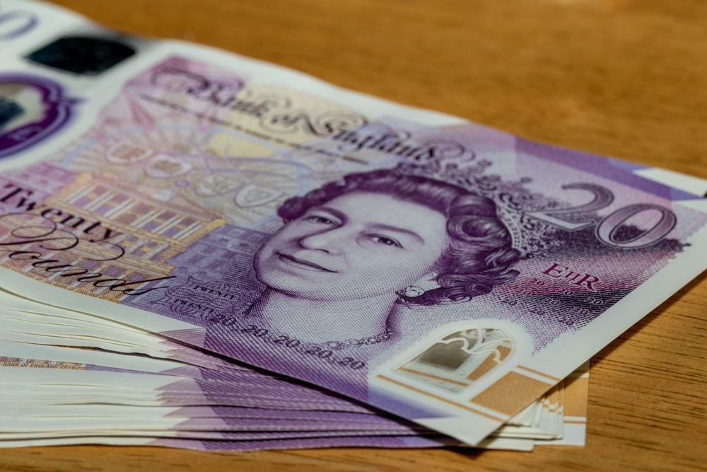 Stack of twenty pound banknotes featuring Queen Elizabeth II