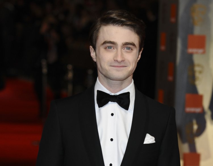 Daniel Radcliffe wearing a black suit